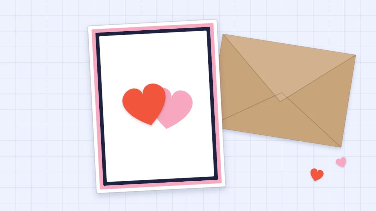 A handmade anniversary card with two overlapping paper hearts in red and pink on a double mat
