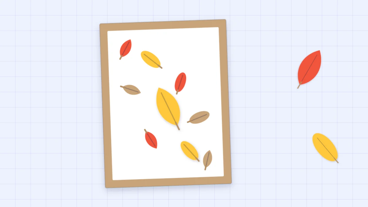 A handmade autumn card with red, yellow and brown paper leaves drifting diagonally across a white panel