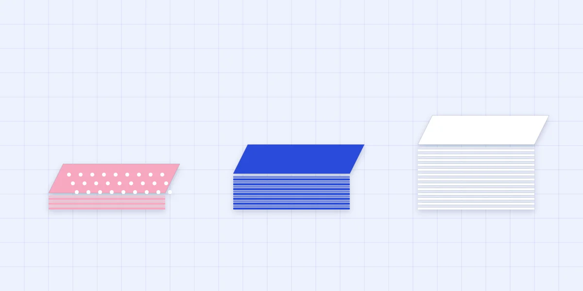 Three stacks of paper from thin patterned paper to medium cardstock to heavy white cardstock