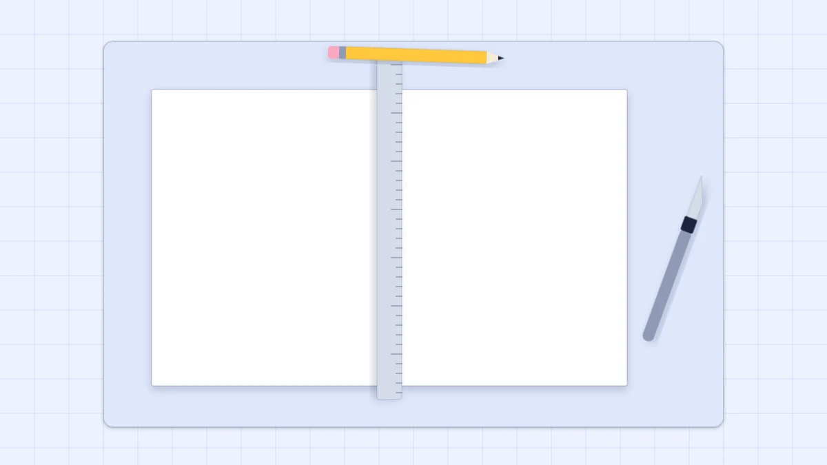 A sheet of white cardstock cut into two equal halves on a cutting mat with a steel ruler and a craft knife